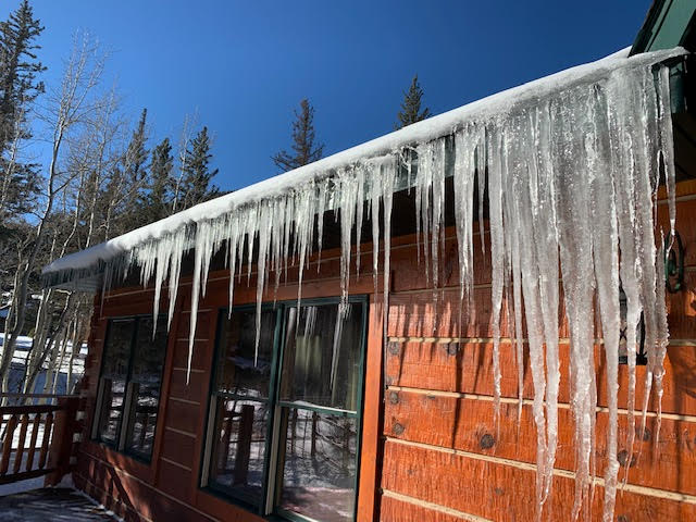 Ice damming and icicles on home